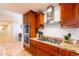 Close up on a gourmet kitchen showcasing stainless steel appliances, granite counters, and custom wood cabinets at 1438 E Mesquite St, Gilbert, AZ 85296