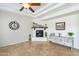 Living room features a fireplace, mantel decor, tile floors, and neutral wall colors at 1438 E Mesquite St, Gilbert, AZ 85296