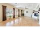 Spacious living room with tile floors, fireplace, and multiple windows for plenty of natural light at 1438 E Mesquite St, Gilbert, AZ 85296