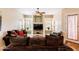 Spacious living room with a ceiling fan, comfortable seating, and tiled flooring at 1438 E Mesquite St, Gilbert, AZ 85296