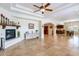 Living room with tiled floors, fireplace, and open floor plan to the kitchen at 1438 E Mesquite St, Gilbert, AZ 85296
