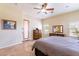 Bright main bedroom with a view of the pool and access to the outdoors at 1438 E Mesquite St, Gilbert, AZ 85296