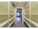 Walk-in pantry featuring built-in shelving for optimal storage and organization at 1438 E Mesquite St, Gilbert, AZ 85296