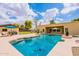Backyard pool featuring sun umbrellas, desert landscaping, and an open view of the house at 1438 E Mesquite St, Gilbert, AZ 85296