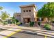 Community clubhouse featuring desert landscaping, a well-maintained exterior, and ample parking at 14458 W Zuni Trl, Surprise, AZ 85374