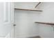 Walk-in closet featuring custom storage solutions and carpet floors at 14458 W Zuni Trl, Surprise, AZ 85374