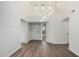 Bright foyer featuring wood-look floors and access to various rooms at 14458 W Zuni Trl, Surprise, AZ 85374