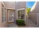 Welcoming front entrance with a decorative security door and desert landscaping at 14458 W Zuni Trl, Surprise, AZ 85374