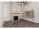 The living room features a fireplace and shuttered windows that provide plenty of natural light at 14458 W Zuni Trl, Surprise, AZ 85374