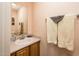 Cozy bathroom features a vanity with a mirror and a towel rack with fresh towels at 14950 W Mountain View Blvd # 7309, Surprise, AZ 85374