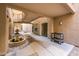 Exterior courtyard view with fountain, decorative rock, and building architecture at 14950 W Mountain View Blvd # 7309, Surprise, AZ 85374