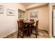 Cozy dining area with a round table, seating for four, and decorative wall art at 14950 W Mountain View Blvd # 7309, Surprise, AZ 85374