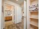 Hallway with views to the bathroom, bedroom and closet, plus plank flooring at 14950 W Mountain View Blvd # 7309, Surprise, AZ 85374