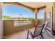 Inviting patio with seating area offering views of the manicured landscaping and blue skies at 14950 W Mountain View Blvd # 7309, Surprise, AZ 85374