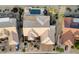 Gorgeous aerial view of home showing desert landscaping, private pool, and well maintained tile roof at 15109 W Waterford Dr, Surprise, AZ 85374