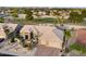 Aerial view of a home next to a golf course, showcasing its desert landscaping and neighborhood at 15109 W Waterford Dr, Surprise, AZ 85374