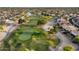 Panoramic aerial view of a golf course community with single Gathering homes, lakes, and green spaces at 15109 W Waterford Dr, Surprise, AZ 85374