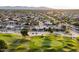 Beautiful aerial view overlooking a golf course community with mature trees and well-maintained homes at 15109 W Waterford Dr, Surprise, AZ 85374