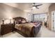 Main bedroom boasts a sitting area, ceiling fan, and neutral walls, creating a relaxing retreat at 15109 W Waterford Dr, Surprise, AZ 85374