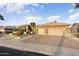 Beautiful home featuring a three-car garage and a well-maintained desert landscaped front yard at 15109 W Waterford Dr, Surprise, AZ 85374