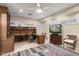 Versatile flex room with built-in desk, a ceiling fan, recessed lights, and ample natural light at 15109 W Waterford Dr, Surprise, AZ 85374