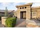 Charming front entrance featuring desert landscaping, seating area and beautiful architectural stone details at 15109 W Waterford Dr, Surprise, AZ 85374