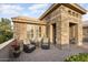 Cozy front patio featuring stone accents and comfortable seating, perfect for outdoor relaxation at 15109 W Waterford Dr, Surprise, AZ 85374
