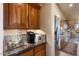 Gourmet kitchen area features granite countertops, stainless steel appliances, and custom cabinetry at 15109 W Waterford Dr, Surprise, AZ 85374