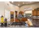 Elegant kitchen boasts granite countertops, stainless steel appliances, and custom cabinetry at 15109 W Waterford Dr, Surprise, AZ 85374