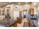 Spacious kitchen features granite countertops, ample cabinetry, and seamlessly connects to the living area at 15109 W Waterford Dr, Surprise, AZ 85374