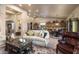 Spacious living room features an open floor plan, seamlessly connecting the kitchen and dining area at 15109 W Waterford Dr, Surprise, AZ 85374