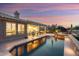Gorgeous pool and patio at twilight provide a relaxing outdoor living space at 15109 W Waterford Dr, Surprise, AZ 85374