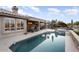Backyard swimming pool with patio area and views of the lush landscaping and golf course at 15109 W Waterford Dr, Surprise, AZ 85374