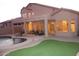 Backyard features a private pool, covered patio with lounge seating, and manicured landscaping at 15229 S 18Th Dr, Phoenix, AZ 85045