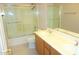 Bathroom with a double sink vanity, shower, and white tile flooring at 15229 S 18Th Dr, Phoenix, AZ 85045