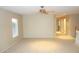 Spacious bonus room with neutral walls, carpet flooring, ceiling fan, and natural light at 15229 S 18Th Dr, Phoenix, AZ 85045