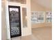 Front entryway with a decorative security door and sidelight windows, offering natural light and security at 15229 S 18Th Dr, Phoenix, AZ 85045