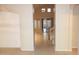 Inviting hallway featuring tile flooring and a staircase with a wooden handrail at 15229 S 18Th Dr, Phoenix, AZ 85045