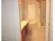Lavish bathroom with double vanity, soaking tub, glass shower, and decorative glass block window at 15229 S 18Th Dr, Phoenix, AZ 85045