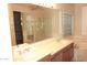 Lavish bathroom with double vanity, soaking tub, glass shower, and walk-in closet at 15229 S 18Th Dr, Phoenix, AZ 85045