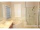 Elegant bathroom featuring a soaking tub, separate glass shower, and abundant natural light at 15229 S 18Th Dr, Phoenix, AZ 85045