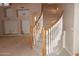 Elegant foyer showcasing a curved staircase with white spindles and warm wood railing at 15229 S 18Th Dr, Phoenix, AZ 85045