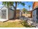 Backyard featuring a storage shed with mature shade trees at 1529 W Rovey Ave, Phoenix, AZ 85015