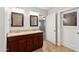 The bathroom features a double sink vanity with granite countertops, as well as great lighting at 1529 W Rovey Ave, Phoenix, AZ 85015