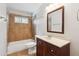 The bathroom includes a shower/tub combo with stylish tile and a single sink vanity at 1529 W Rovey Ave, Phoenix, AZ 85015