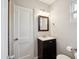 The bathroom has a single sink vanity with a stylish mirror and great lighting at 1529 W Rovey Ave, Phoenix, AZ 85015