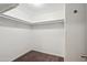 Spacious walk-in closet featuring ample storage and neutral carpeting at 1529 W Rovey Ave, Phoenix, AZ 85015