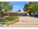 Charming single-story brick home with well-manicured lawn and mature shade trees at 1529 W Rovey Ave, Phoenix, AZ 85015