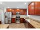 Beautiful kitchen featuring stainless steel appliances, granite countertops, and modern fixtures at 1529 W Rovey Ave, Phoenix, AZ 85015
