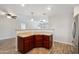 An eat-in peninsula with granite countertops in the kitchen offers an open-concept layout at 1529 W Rovey Ave, Phoenix, AZ 85015